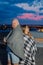 Beautiful couple on the roof under a blanket in the evening.