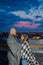 Beautiful couple on the roof under a blanket in the evening.