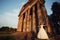 Beautiful couple in wedding dress outdoors near the old victorian church