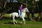 Beautiful cowgirl ride her horse in woods glade