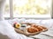 Beautiful cozy breakfast in bed, home bedroom interior with bright morning light, healthy food on decorated tray