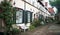 Beautiful cozy courtyard with benches, plants and flowers in the street of old town, Lubeck, Germany