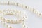 Beautiful creamy pearls necklace curve isolated on white backgro