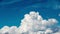 Beautiful Cumulus Clouds on Blue Sky Background