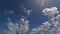 Beautiful cumulus clouds changing shape by viewing in a time lapse during a sunny day