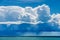 Beautiful Cumulus clouds and torrential rain over the sea - Liguria Italy