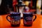 Beautiful cups with hot mulled wine on Christmas market in Meissen, rising steam from hot wine, Saxony, Germany