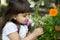 Beautiful curious girl in a garden