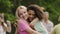 Beautiful curly biracial girl hugging best friend, sincere emotions, friendship