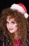 Beautiful curly-headed Santa-girl