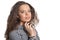 Beautiful curly teenage girl in striped black and white shirt on white background