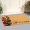 Beautiful cursive welcome peach color doormat with red and black flower plant Placed outside door with green leaves