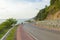 Beautiful curve road by the sea and mountain at Noen-nangphaya view point in Chanthaburi, Thailand.