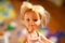 Beautiful and cute face of a children doll with blond hair portrait