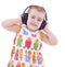 Beautiful cute happy little girl with headphones