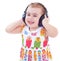 Beautiful cute happy little girl with headphones