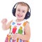 Beautiful cute happy little girl with headphones