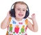 Beautiful cute happy little girl with headphones