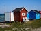 Beautiful cute little wooden beach huts summer houses, painted in lively colors, Aero Island, South Funen, Denmark