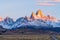 Beautiful dawn golden orange light of sun rise over the Fitz Roy and Cerro Torre peak snow mountain in the morning beside the