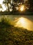 A beautiful dawn with reflection in the water of a forest lake in the city park of Vlaardingen