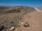 Beautiful day on adventure road trip through desert rock mountain texture landscape route to emptiness with blue sky copyspace