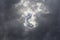 Beautiful day cloudscape view from below of dramatic dramatic grey and white thunder storm clouds on a dark sky background