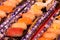 Beautiful decorated assorted raw fish sushi packed in a box containing tuna, salmon
