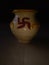 Beautiful decorated clay pot in dark background.