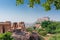 Beautiful decorated garden of Jaswant Thada cenotaph, Jodhpur, Rajasthan, India. Distant view of Mehrangarh fort. Garden has