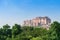 Beautiful decorated garden of Jaswant Thada cenotaph, Jodhpur, Rajasthan, India. Distant view of Mehrangarh fort. Garden has