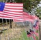 Beautiful decoration of Malaysian flags  hanging at the metal wall. Patriotic concept