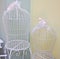 Beautiful decorative cages with pink ribbons