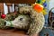 Beautiful decorative hedgehog made of straw with an apple