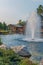 Beautiful decorative lake with a fountain on the background of the hotel complex