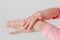 Beautiful delicate women`s hands with pink manicure smudge carin