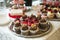 Beautiful delicious cakes. confectionery curry at a festive party. many sweet muffins on a tray