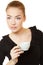 Beautiful delightful young woman in black dress wih cup of tea o