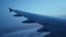 Beautiful descent of a passenger plane into the clouds. Low cloud cover during the flight. Thick Cumulus clouds on the background