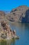 Beautiful desert rock formations line this secluded, Canyon Lake in Tortilla Flat, Tonto National Forest, Arizona