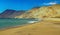 Beautiful deserted lonely pacific ocean bay, empty sand beach, turquoise water, barren arid desert mountains - North Chile,