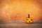 Beautiful design Halloween pumpkin with space on blurred orange background