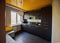 Beautiful designer kitchen in brown and yellow colors