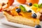 Beautiful dessert: cheesecake with apricots, blueberries and alm