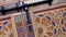 Beautiful detail of a colorful carved wooden Moroccan door.