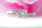 Beautiful diamond rings placed on a pink background