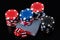 Beautiful dice set, cards and poker chips on a black background