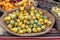 Beautiful and different varieties of squashes and pumpkins on rustic cork basket. Autumn rustic scene. Selective focus. Closeup