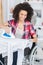 Beautiful disabled woman ironing