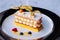 Beautiful dish of Millefeuilles French puff pastry on elegant pl